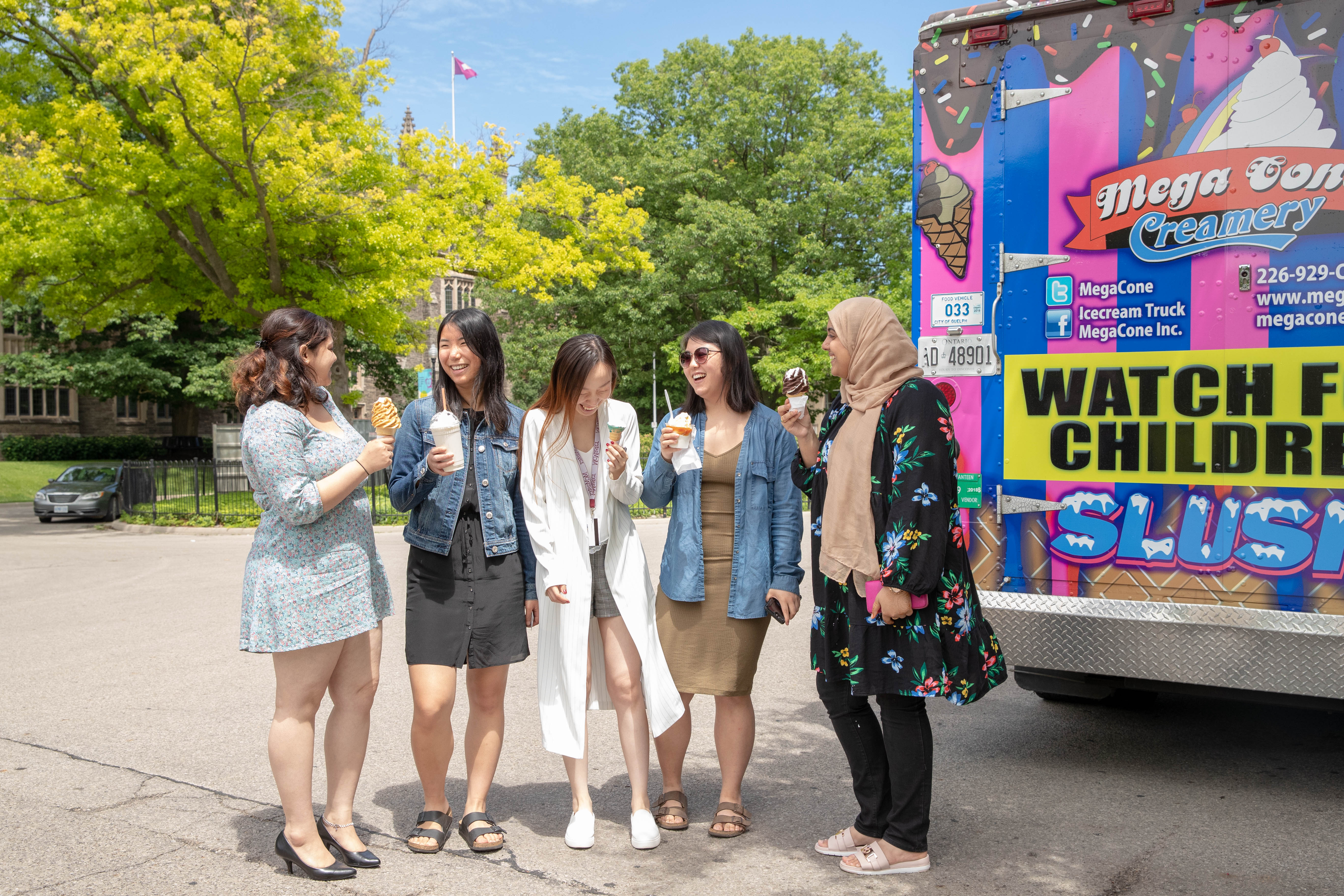Group of female students enjoying ice cream on McMaster campus.